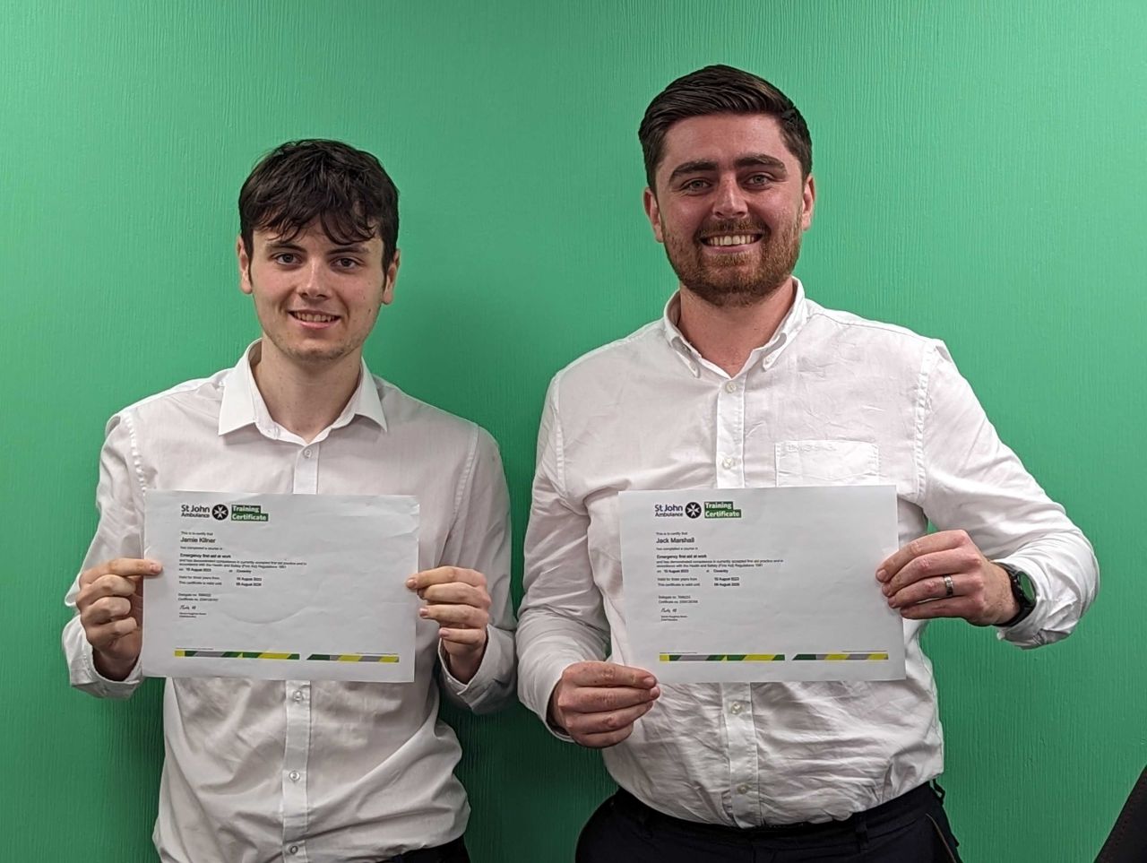 jamie and jack holding a certificate