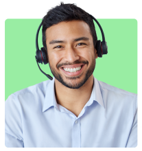 Smiling man wearing a headset and light blue shirt, sitting against a bright green background.