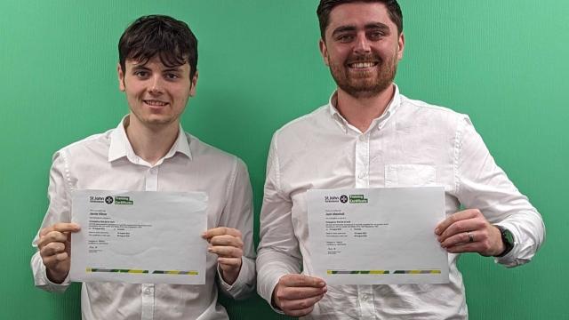 jamie and jack holding a certificate