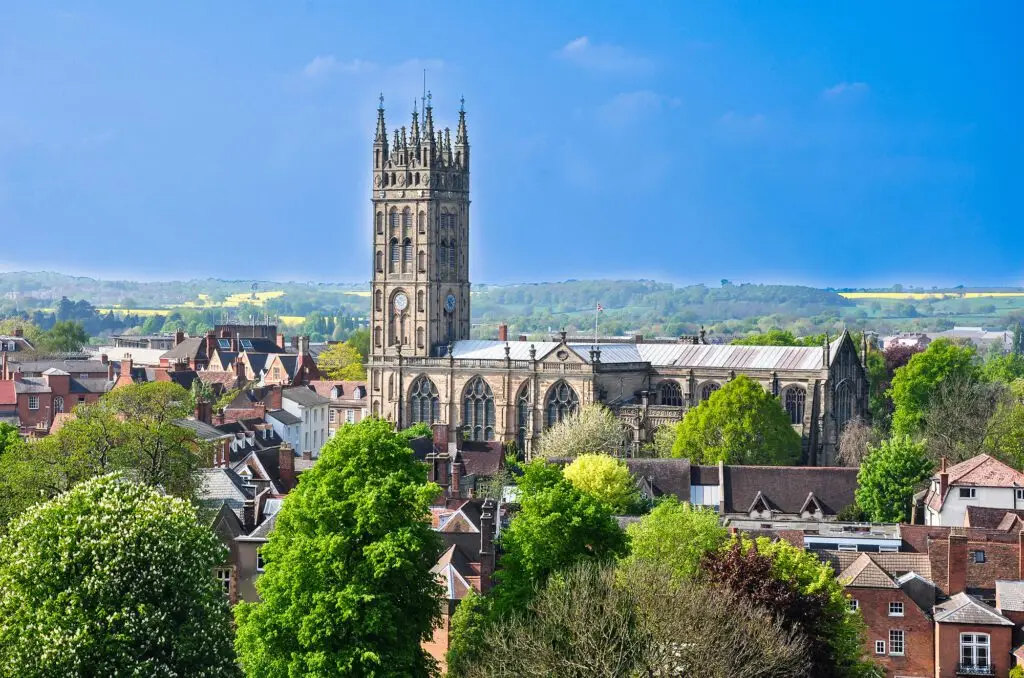 Warwick town centre with St Mary’s Church and countryside in the background