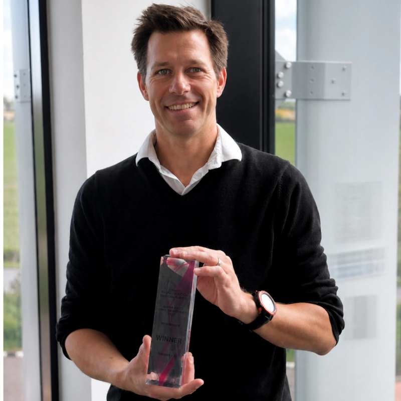 Business leader holding a digital transformation award